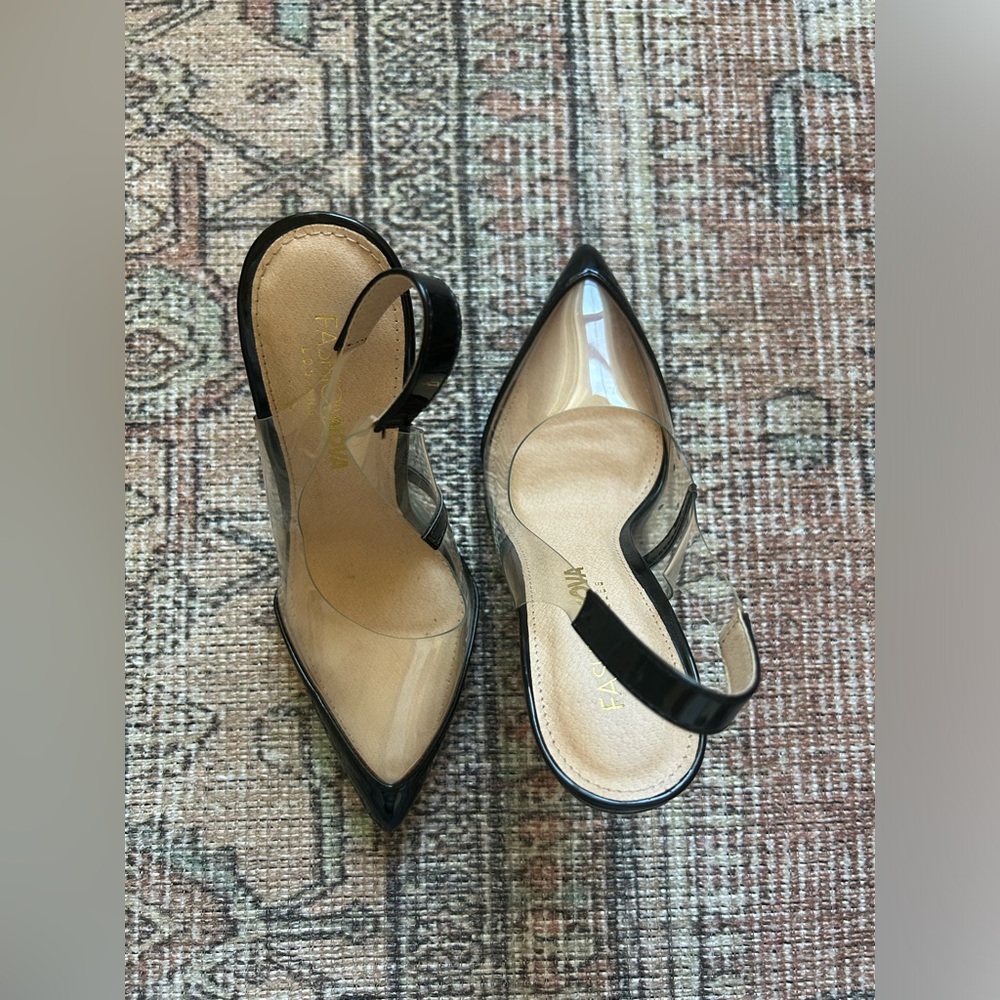 Black and clear pointed toe heels. Only worn inside. Near perfect condition.